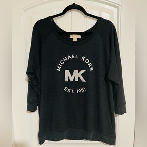 Black Michael Kors 3/4 length sleeved shirt with rhinestone accent
Size: XL